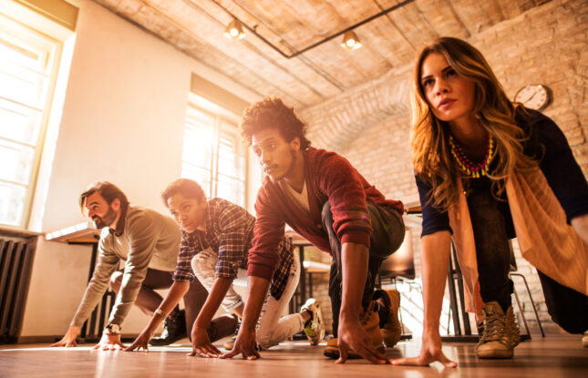 Business Feuds - people lined up to race.